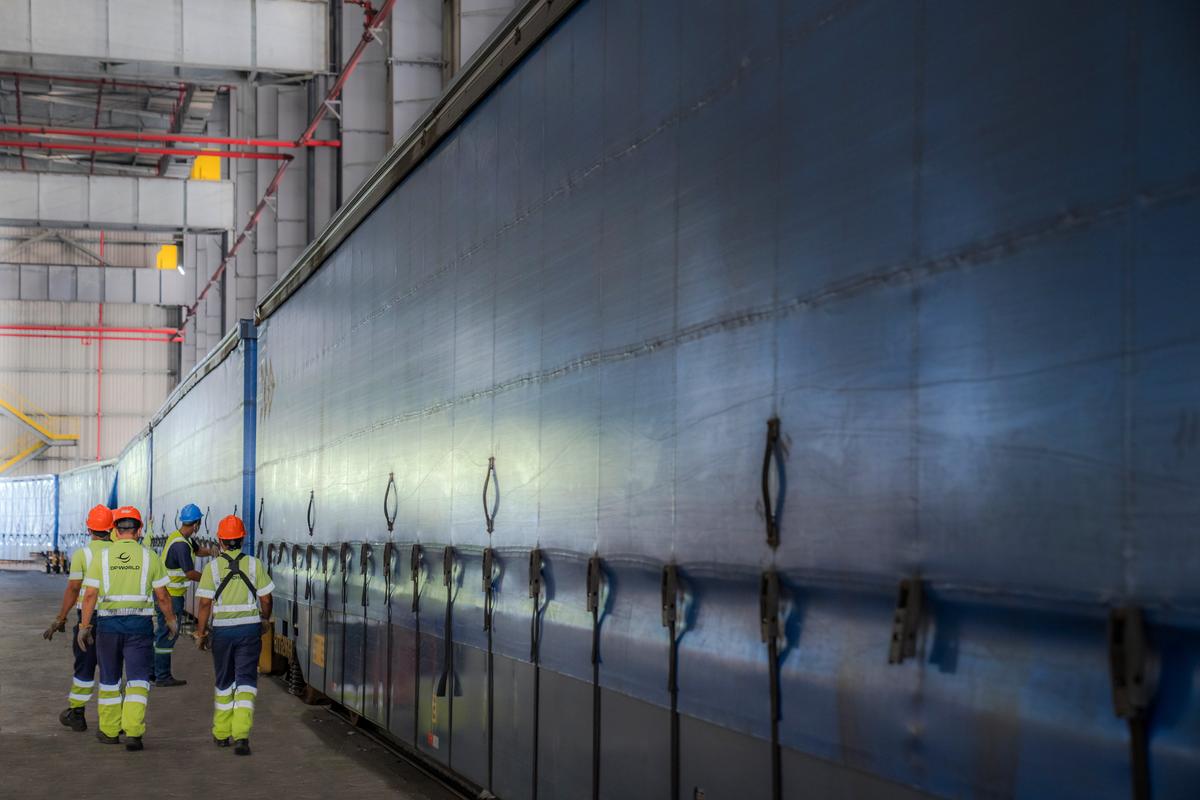 Port employees loading cargo in a port.
