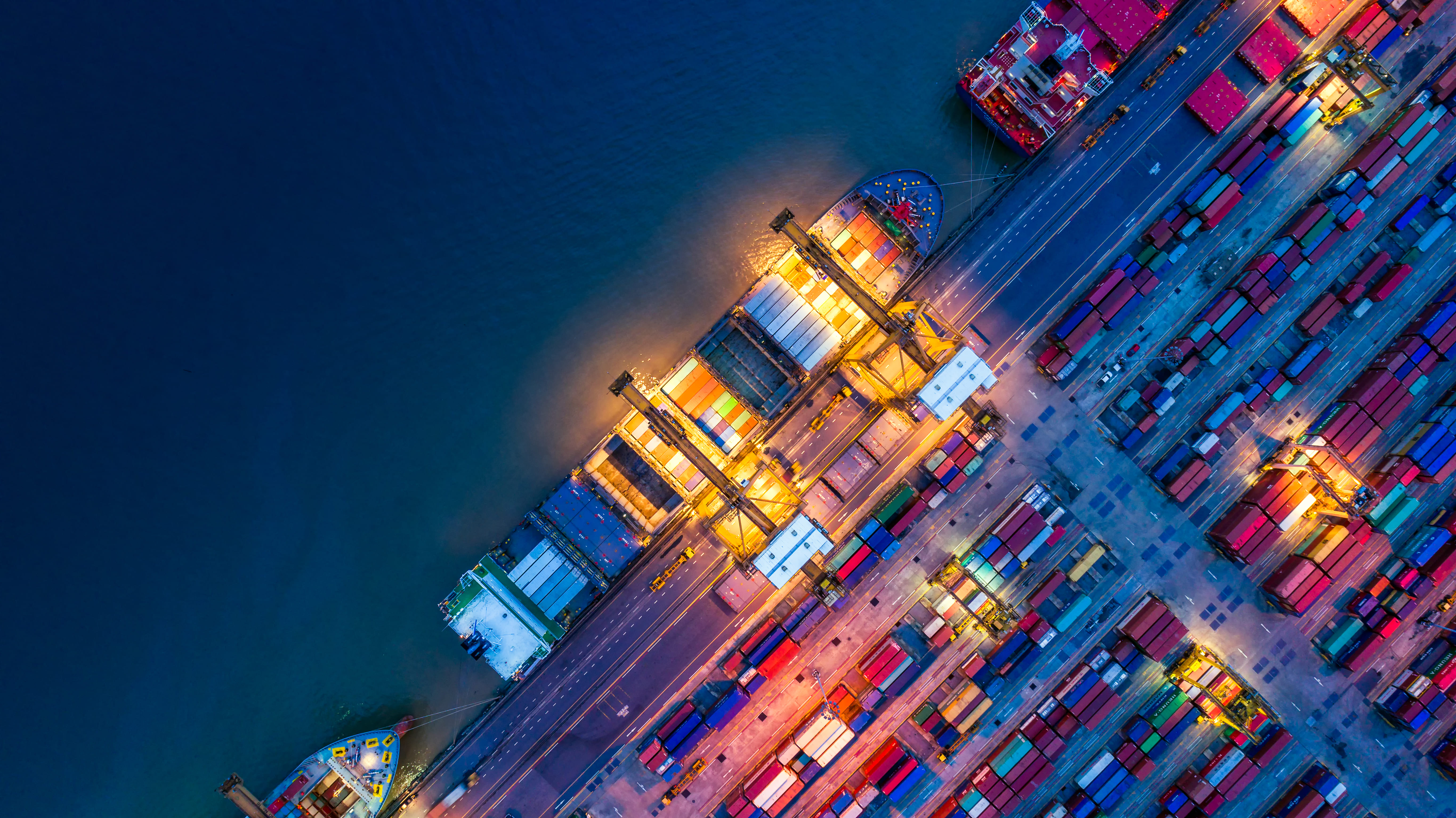 Container ship at a port loading cargo onto the vessel for international shipping
